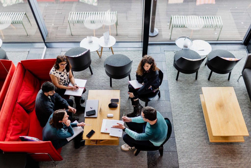 office workers having a meeting around a table