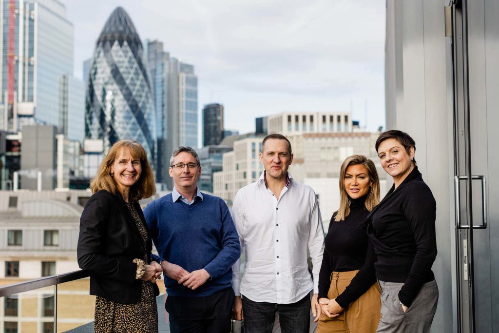 group shot of 5 office workers outdoors in London