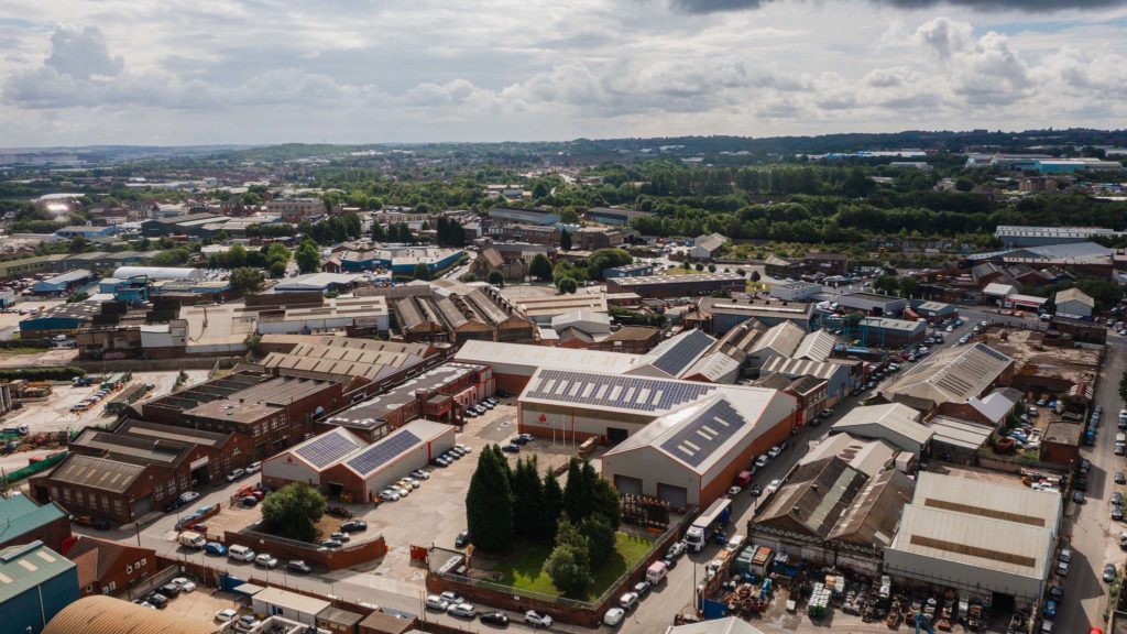 Aerial photo of Sheffield with lots of buildings and clouds in the sky